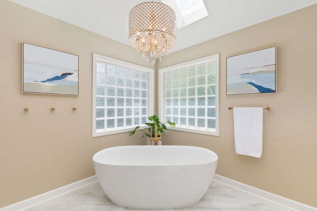 Luxury master bathroom remodel in Kansas City featuring a freestanding soaking tub and custom tile architecture